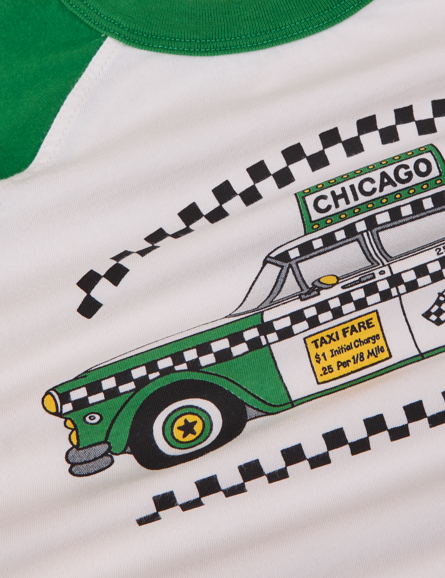 Taxi Raglan Tee in Chicago fabric detail close up. Green taxi cab graphic featured.