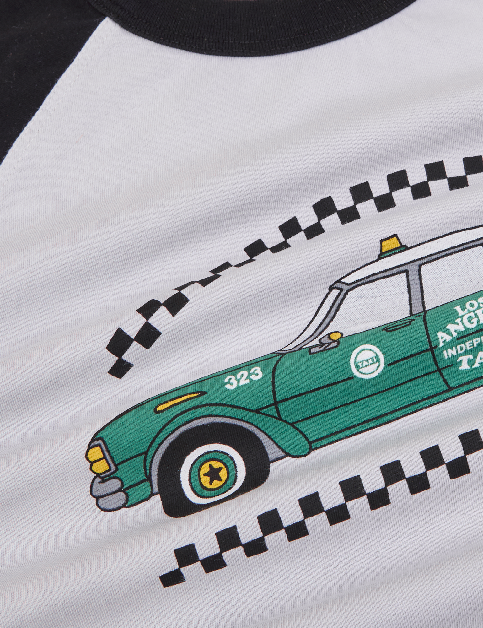 Taxi Raglan Tee in Los Angeles close up of green taxi graphic