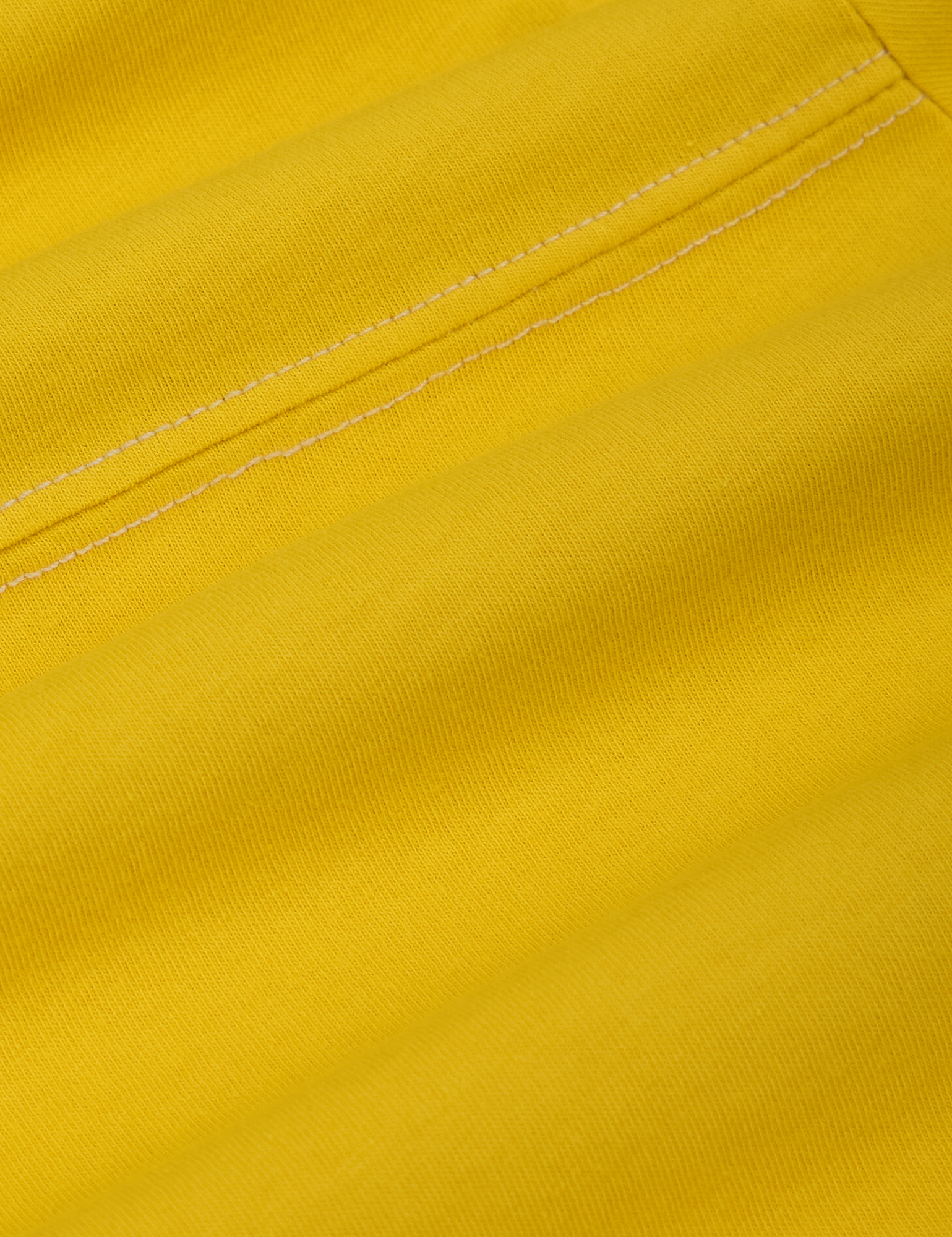 JV Tee in Golden Yellow fabric detail close up