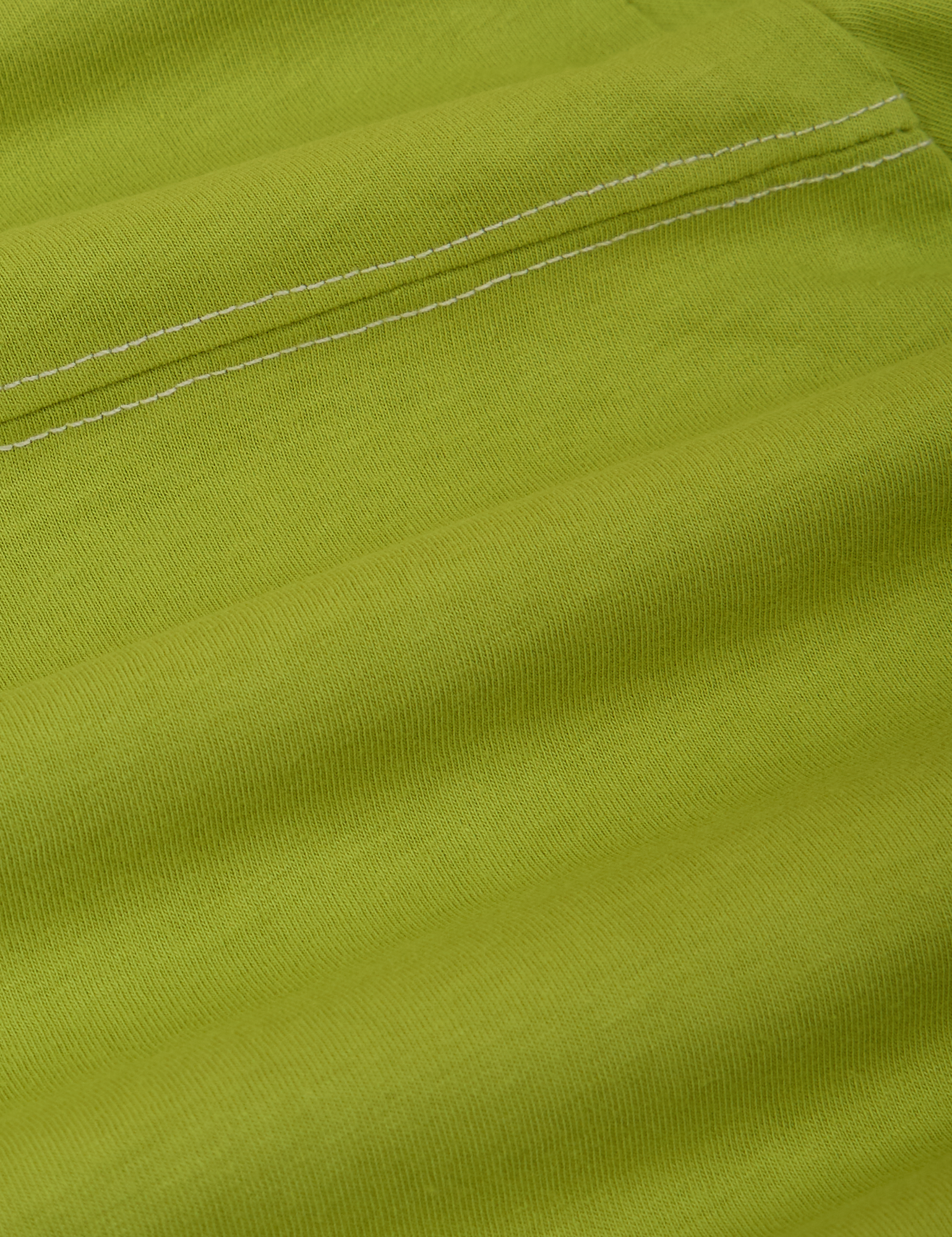 JV Tee in Gross Green fabric detail close up