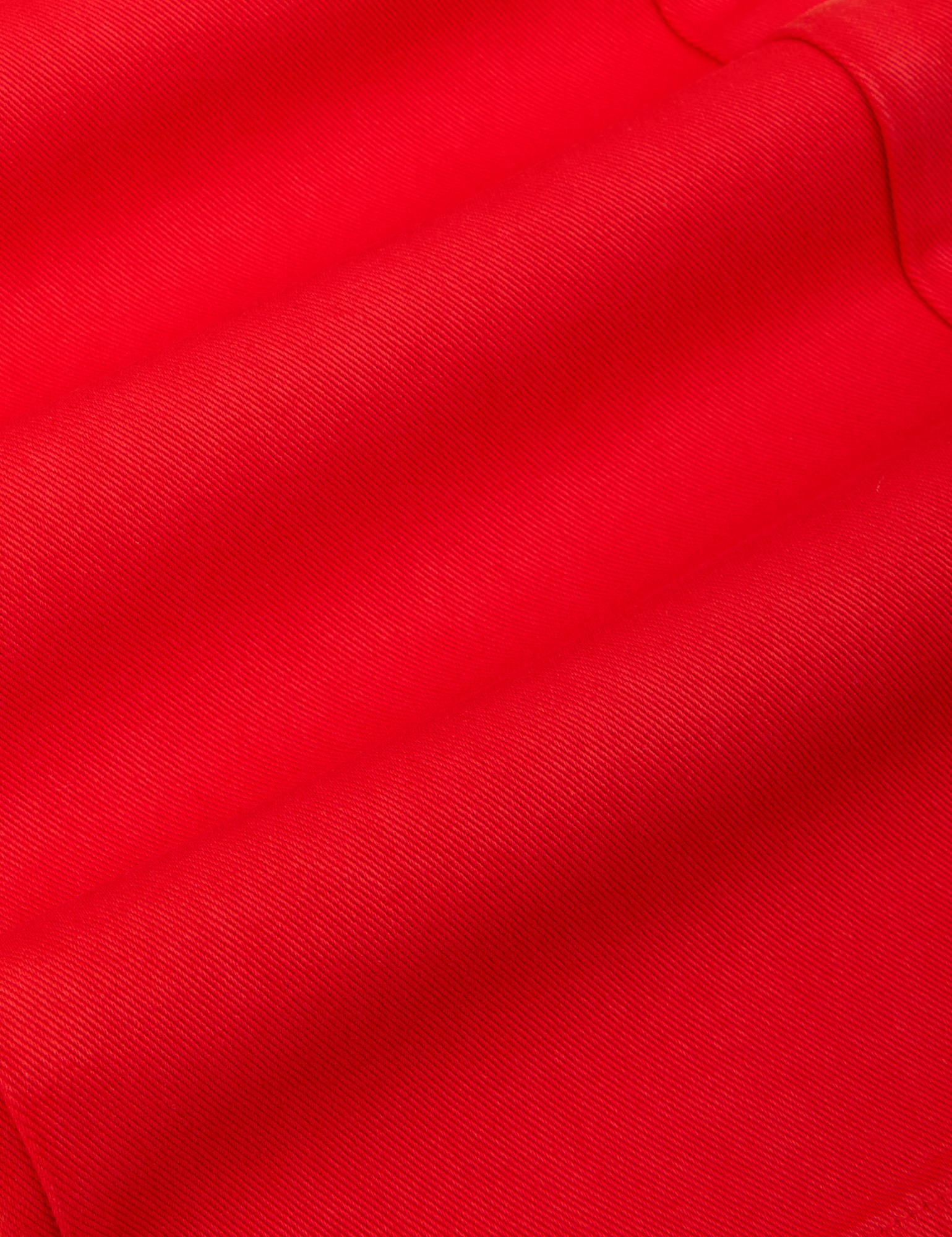 Long Sleeve Jumpsuit in Mustang Red fabric detail close up