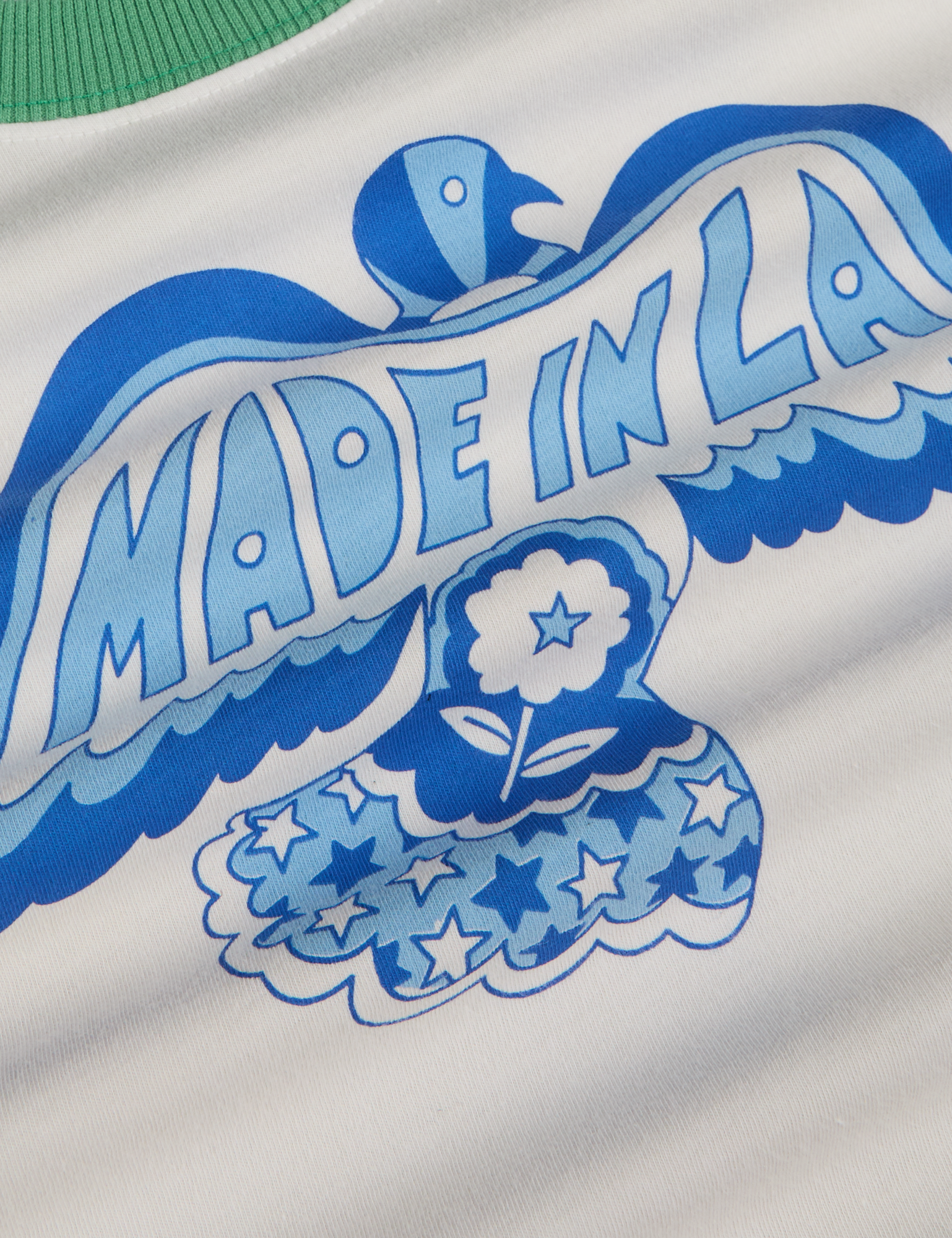 Made in LA Benefit Tee close up of blue dove
