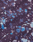 Marble Splatter Work Pants in Nebula Purple fabric detail close up. Paint splattered in blues.
