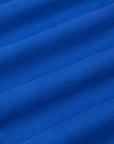 Mid-Rise Pleated Trousers in Royal Blue fabric detail close up