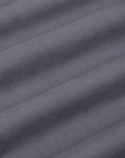 Mid-Rise Pleated Trousers in Slate Grey fabric detail close up