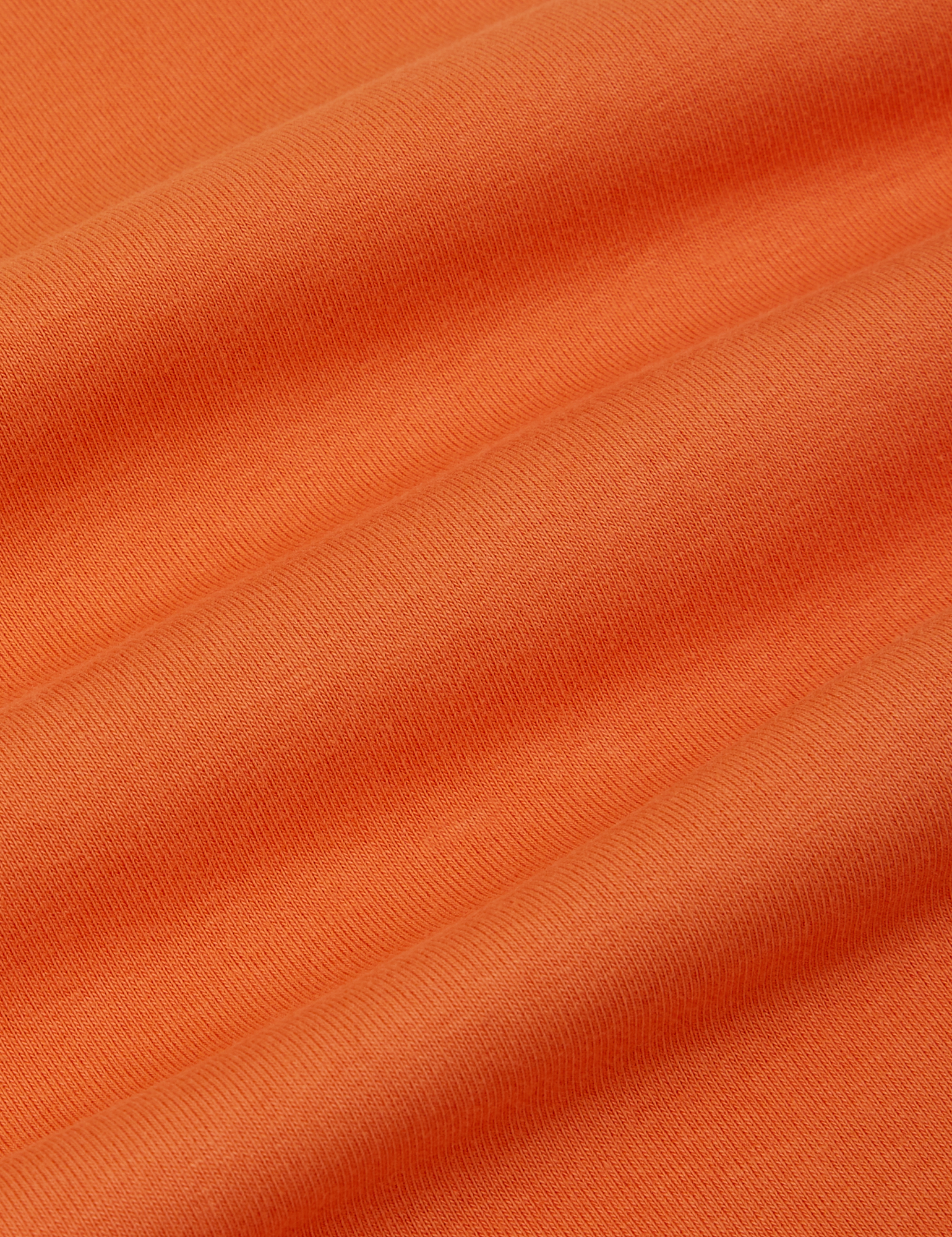 Racerback Tank in Sunset Orange fabric detail close up