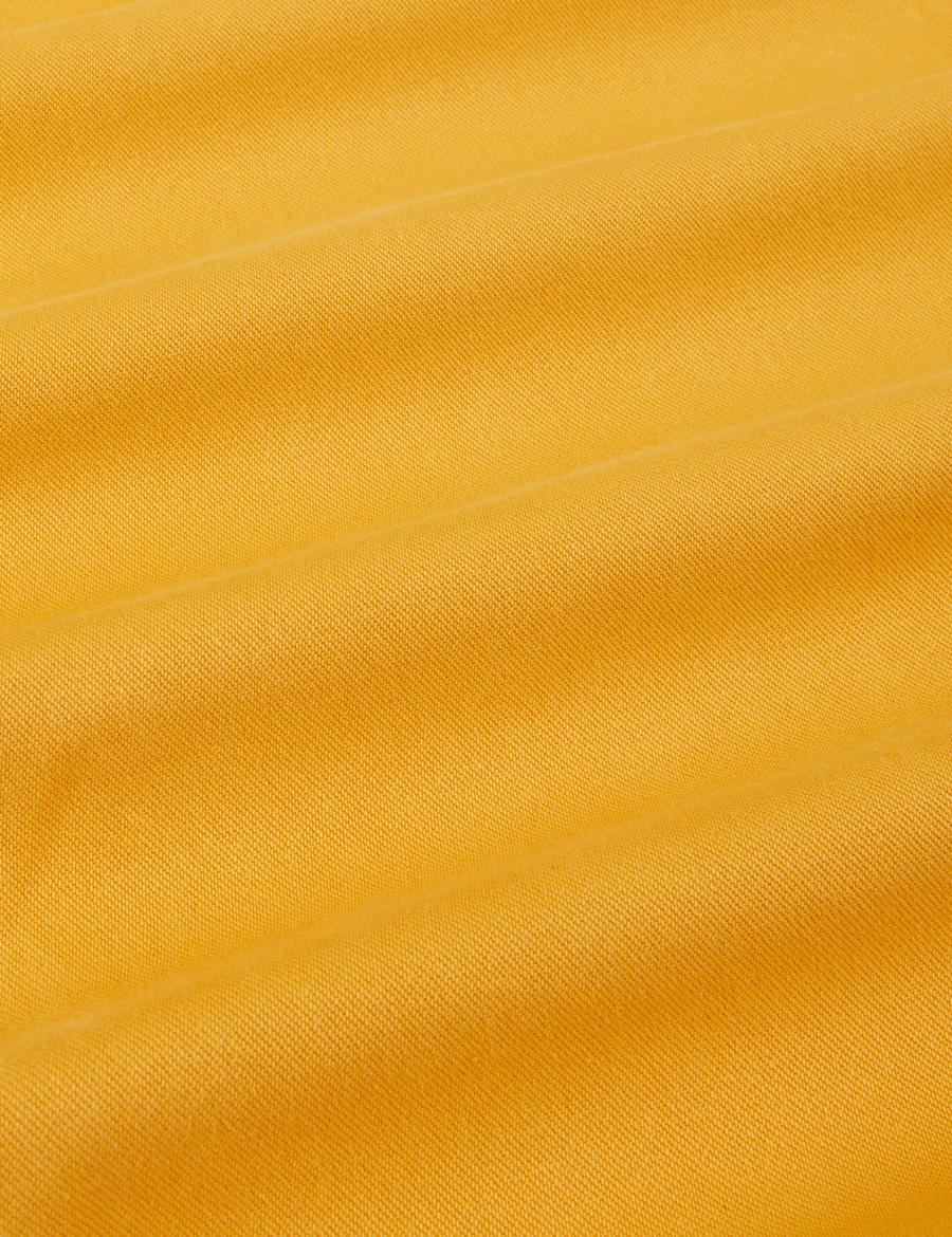 Organic Trousers in Mustard Yellow fabric detail close up