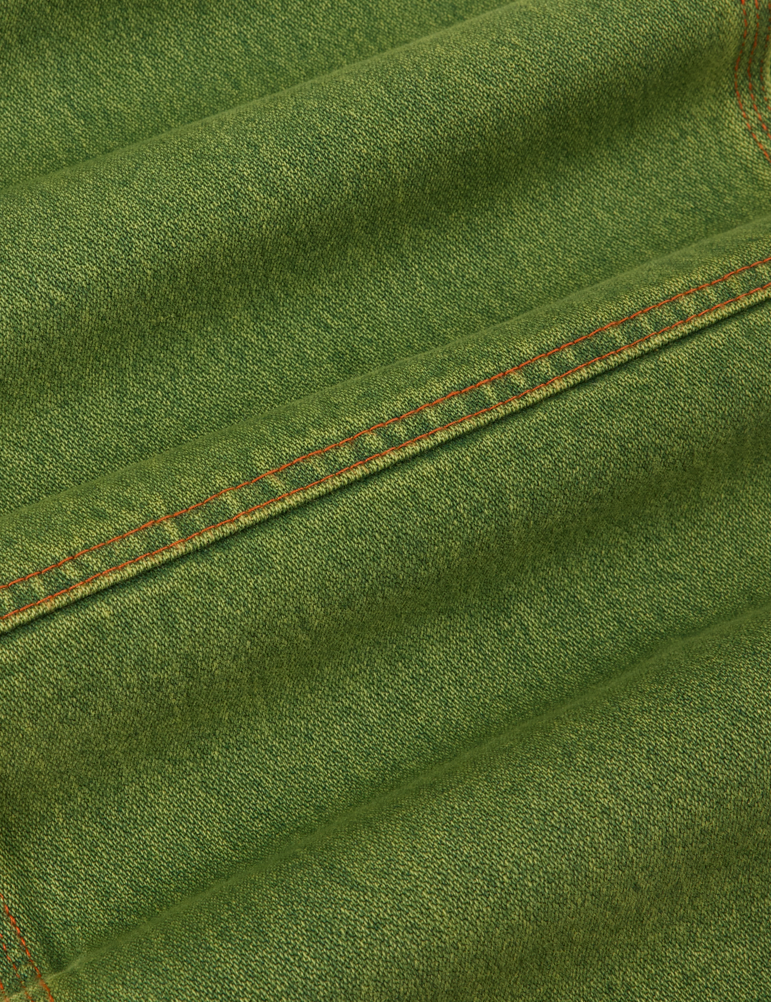 Overdyed Carpenter Jeans in Gross Green fabric detail close up