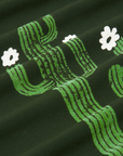 Paintstamped Pantry Button-Up in Cactus fabric detail close up. Paintstamped cactus in green with white flowers