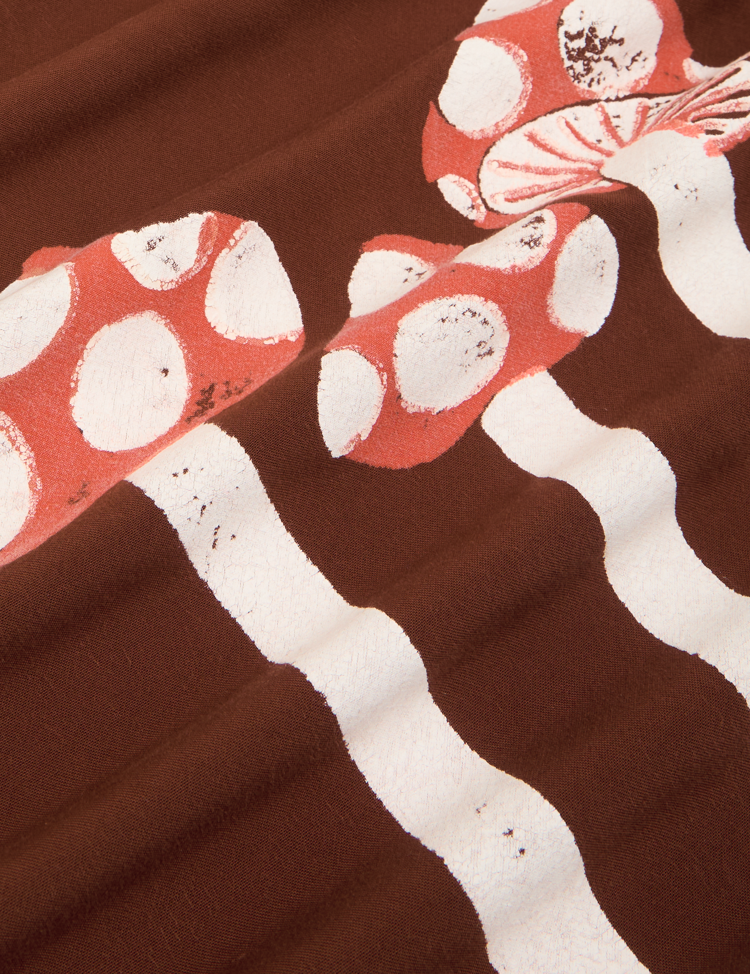 Fabric detail close up Paintstamped Pantry Button-Up in Mushroom. Red and White mushrooms.