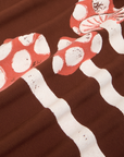 Fabric detail close up Paintstamped Pantry Button-Up in Mushroom. Red and White mushrooms.