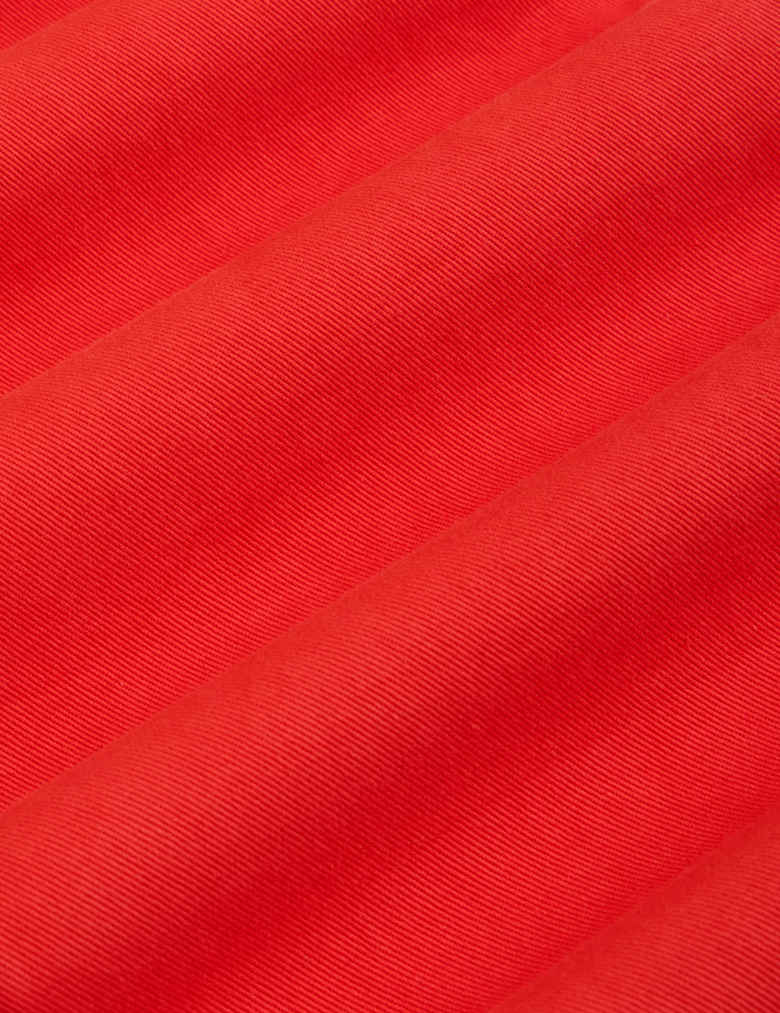 Short Sleeve Jumpsuit in Mustang Red fabric detail close up