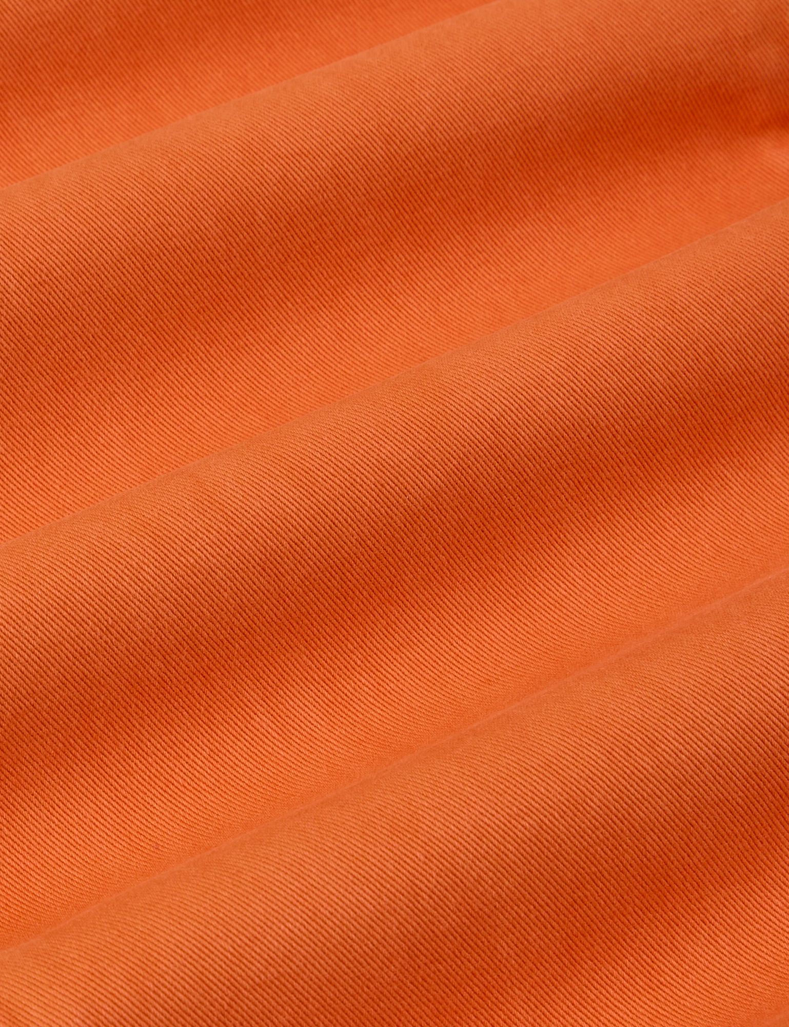 Work Pants in Construction Orange fabric detail close up