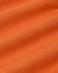 Work Pants in Construction Orange fabric detail close up