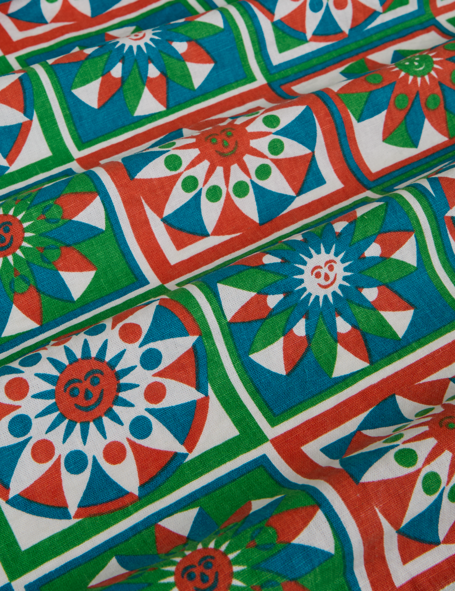 Quilt Print Pantry Button-Up fabric close up of print in green, red, white and blue