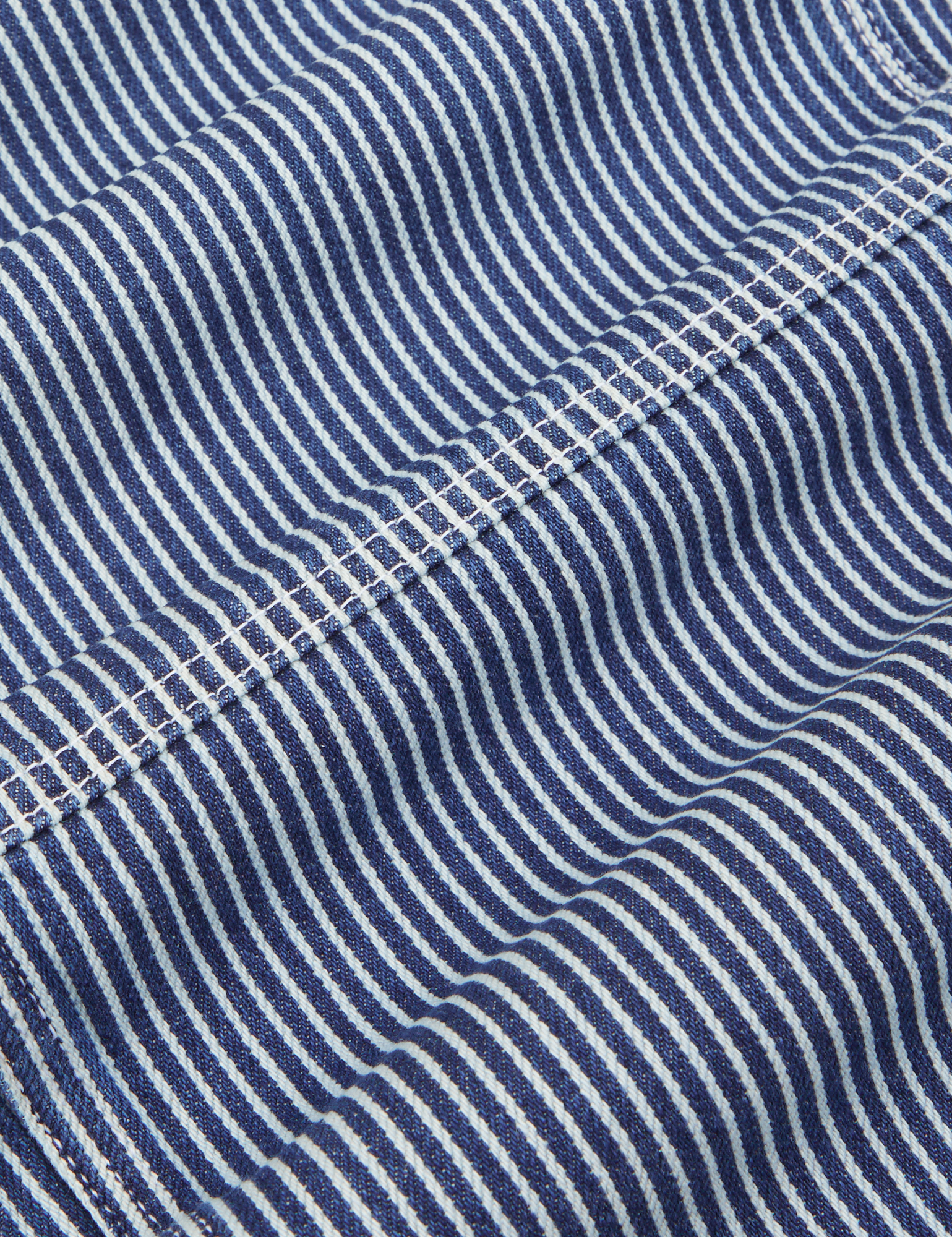 Carpenter Jeans in Indigo Railroad fabric detail close up