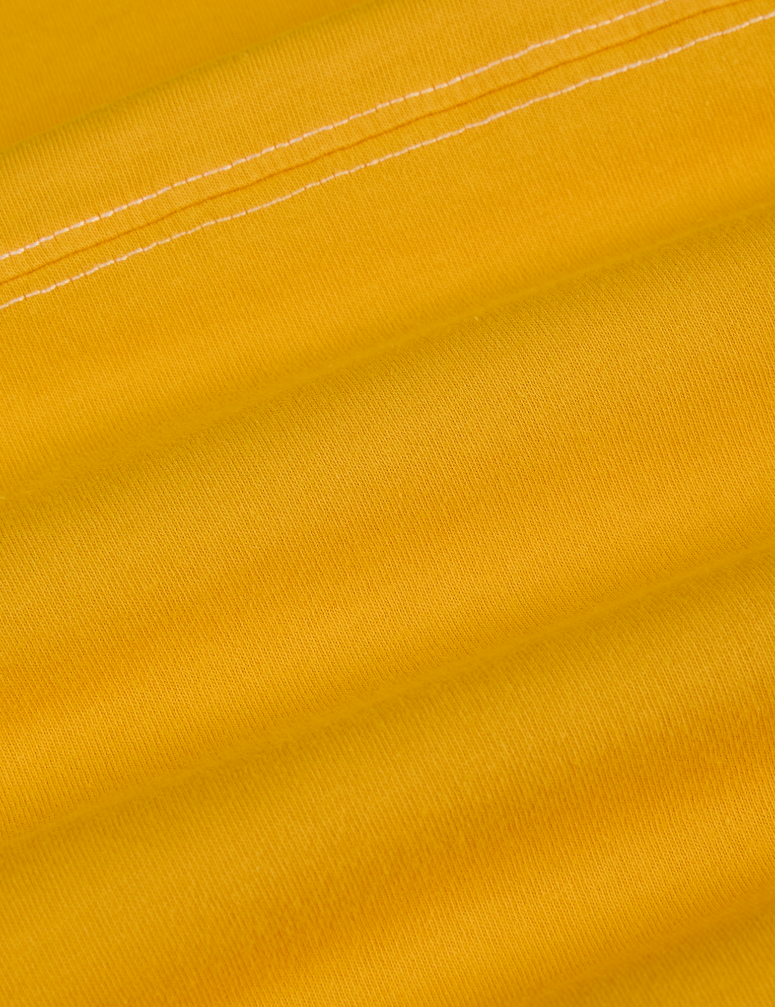 Jr. Varsity Tee in Sunshine Yellow fabric detail close up