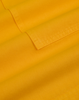 Longline Work Shorts in Sunshine Yellow fabric detail close up