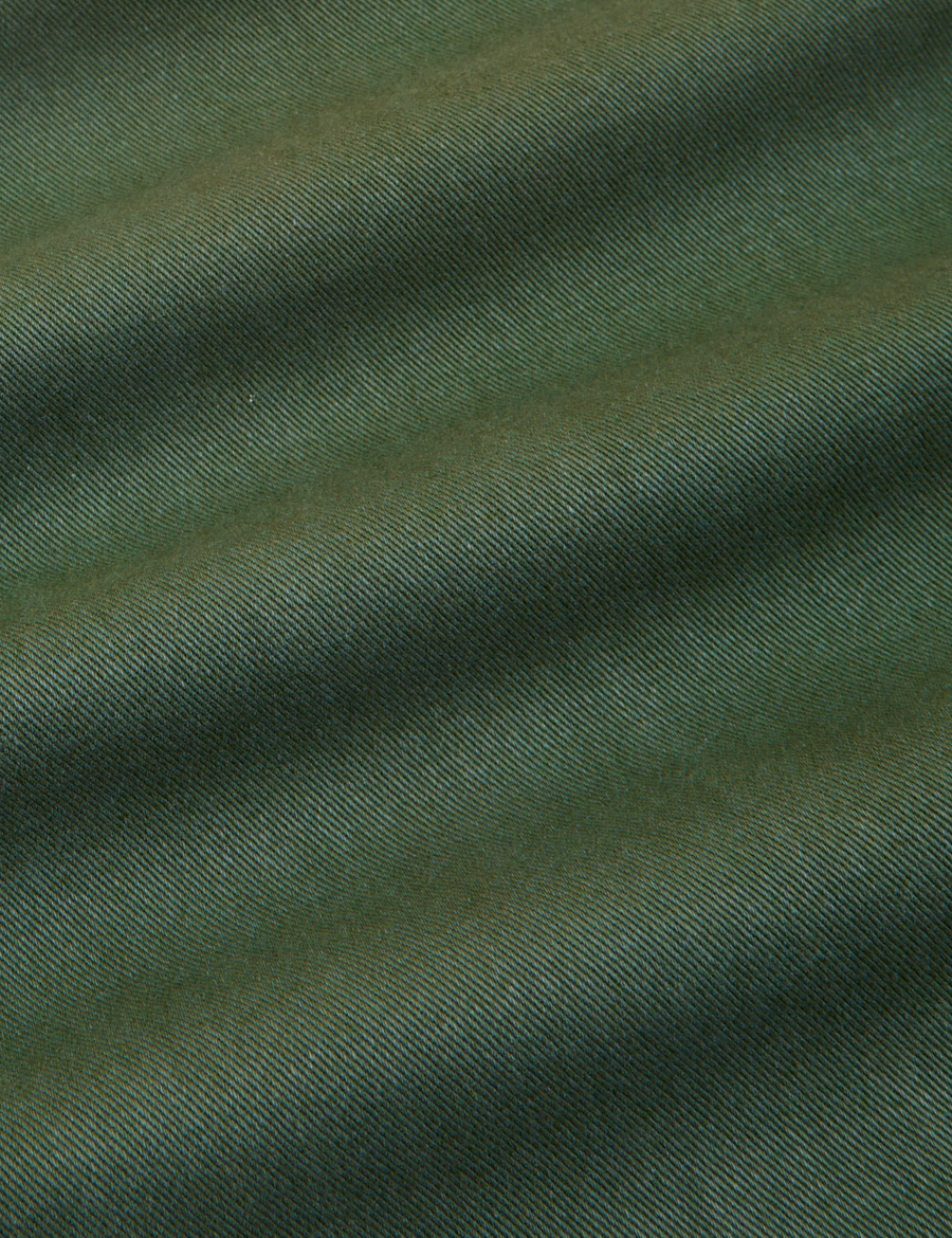 Petite Short Sleeve Jumpsuit in Dark Emerald Green fabric detail close up
