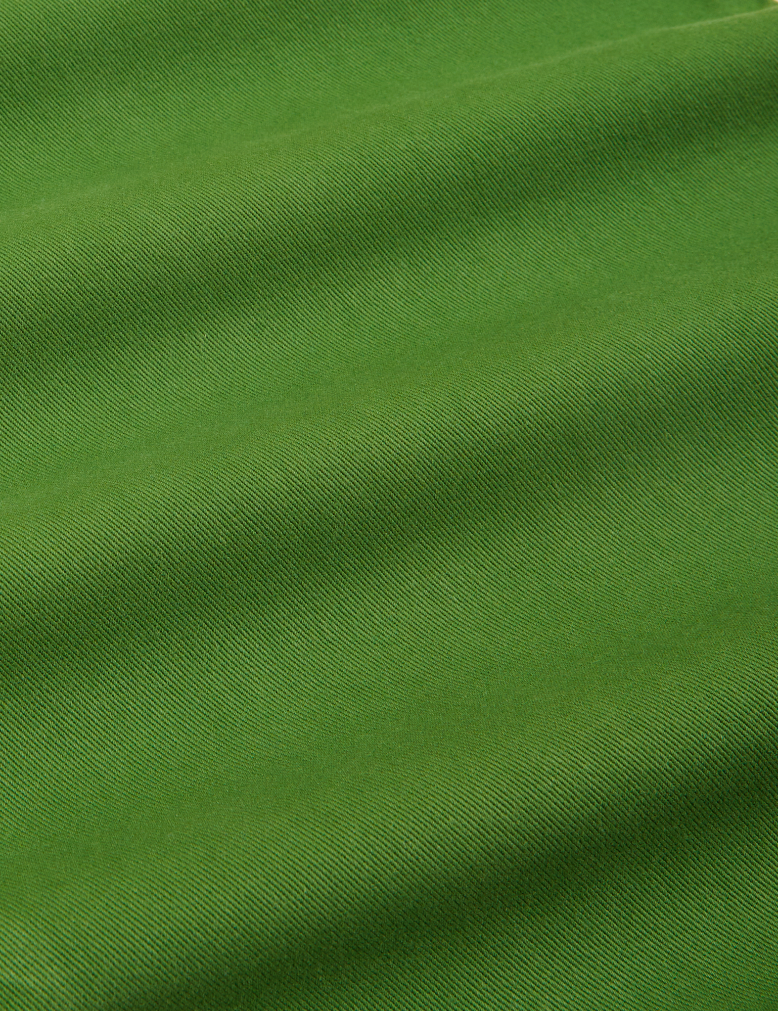 Short Sleeve Jumpsuit in Lawn Green fabric detail close up