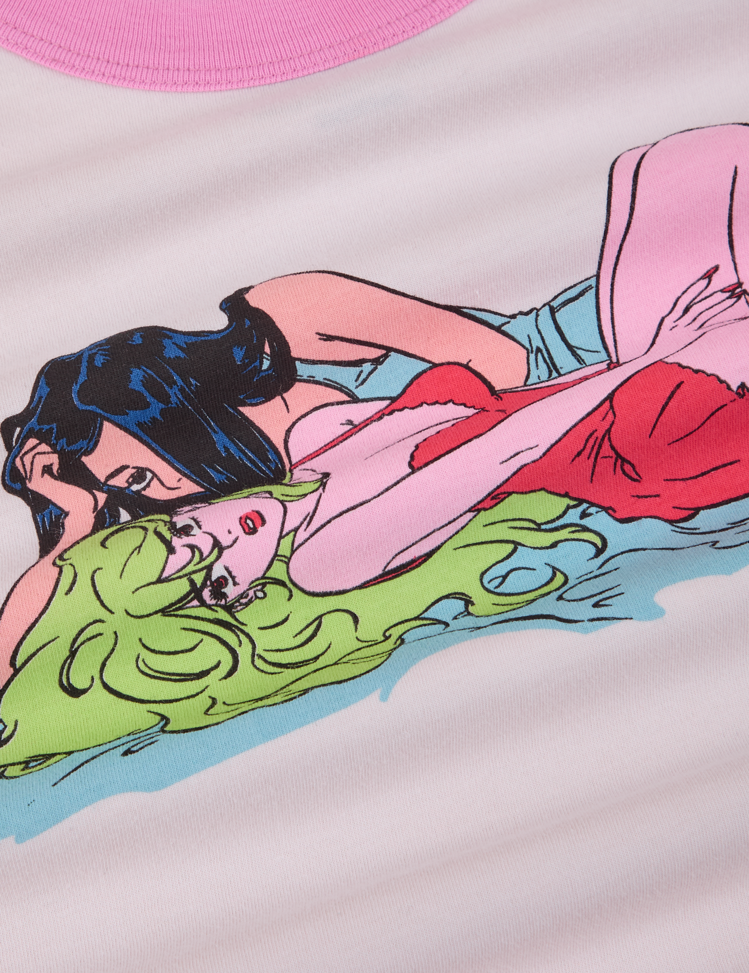 Close up of tee illustration. Two women laying next to each other.