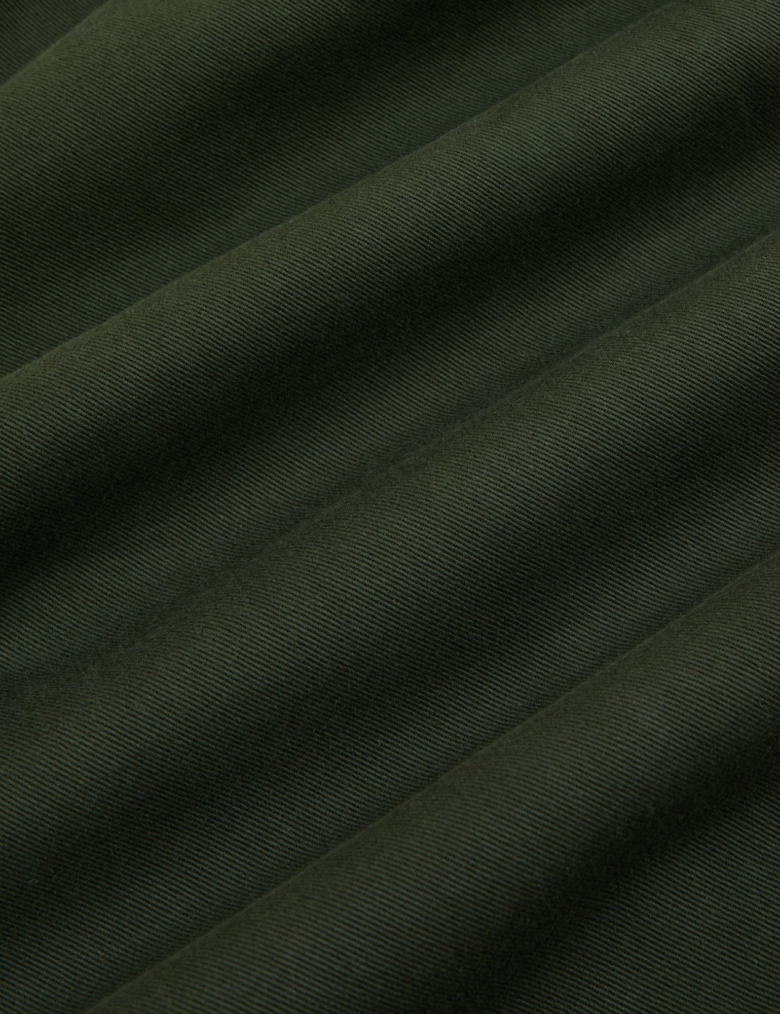 Trouser Shorts in Swamp Green fabric detail close up