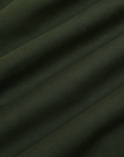 Trouser Shorts in Swamp Green fabric detail close up