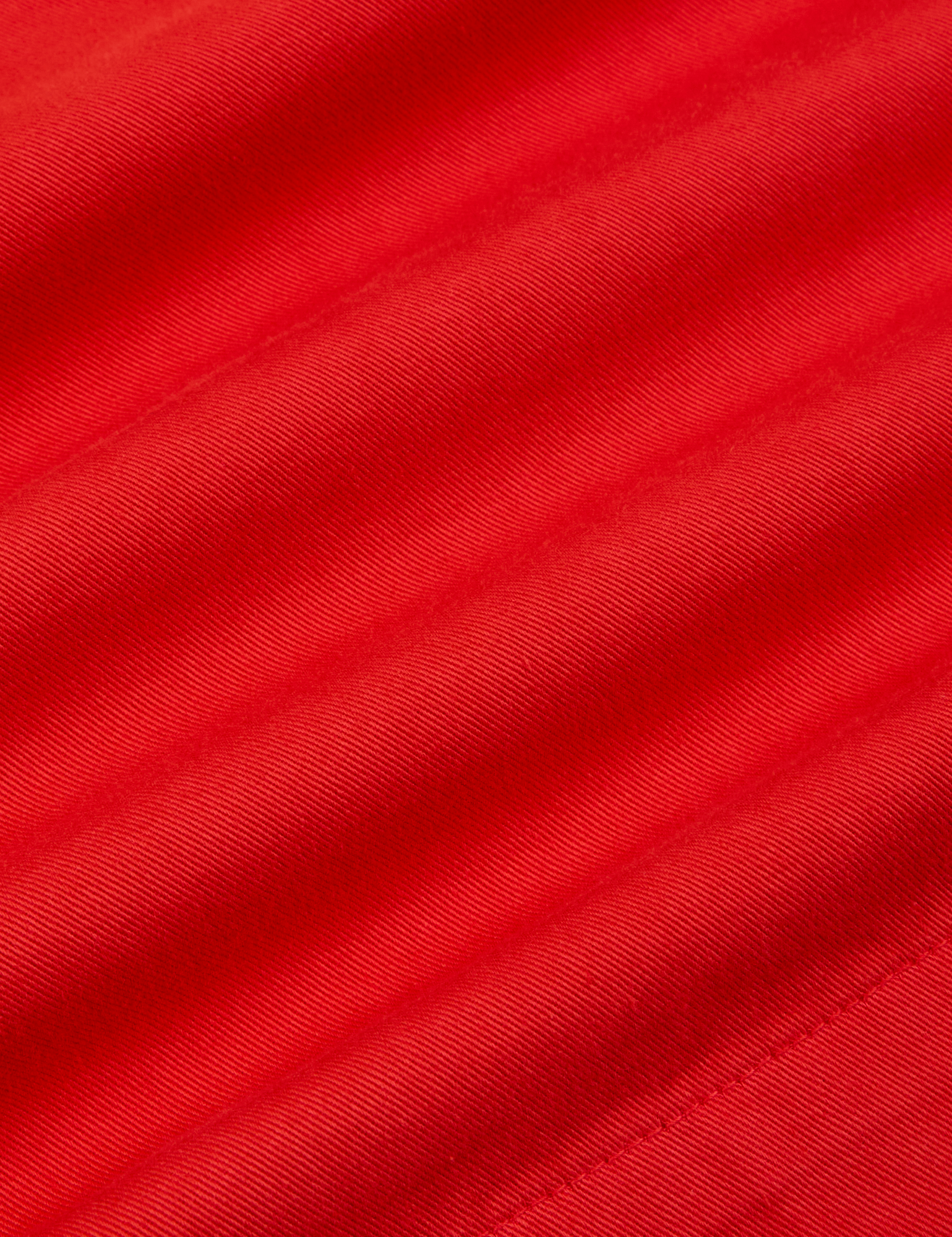 Trouser Shorts in Mustang Red fabric detail close up