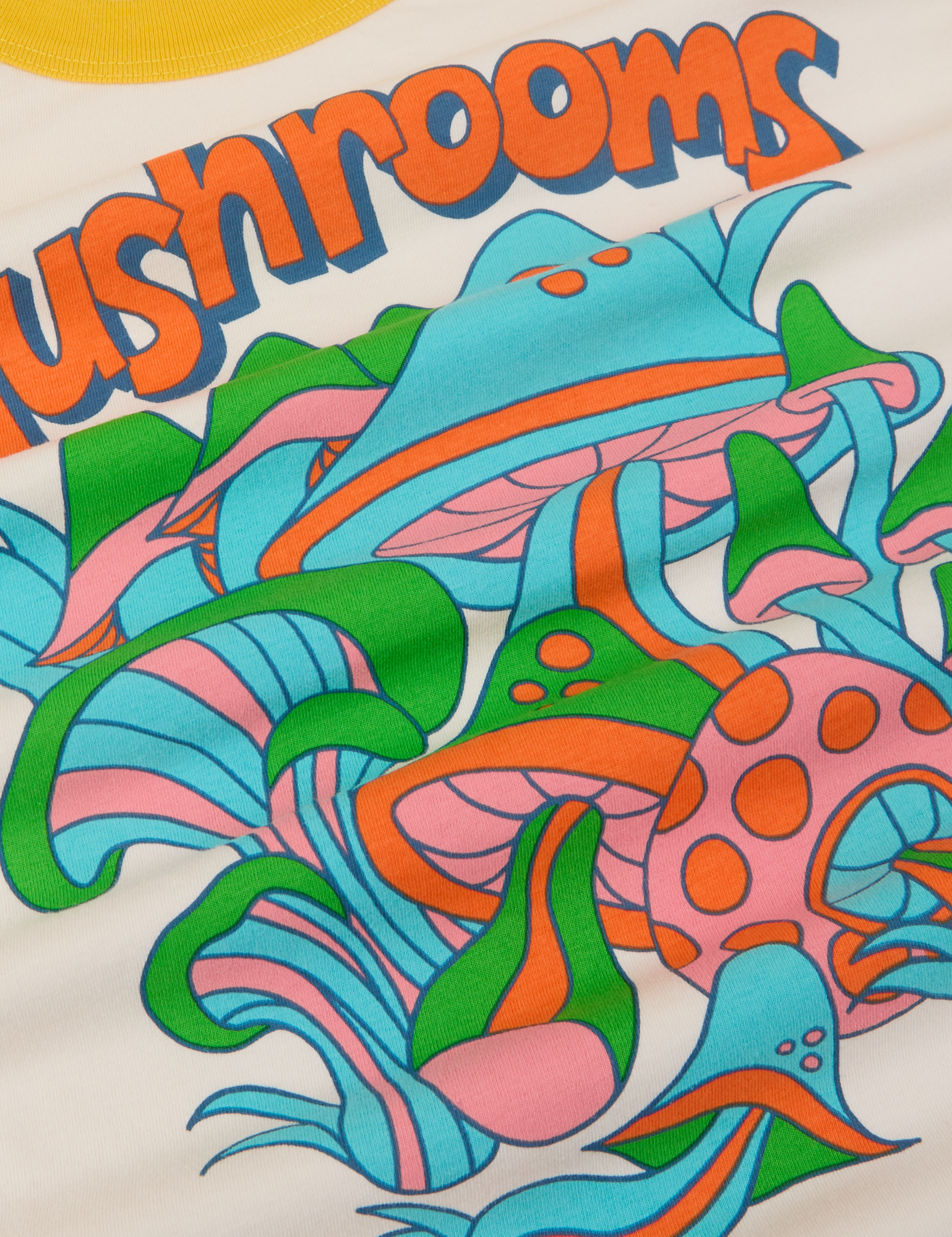 Close up of graphic mushrooms in pink, blue, green and orange