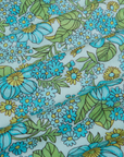 Winter Floral Print Work Pants close up of aqua and yellow flowers with green leaves