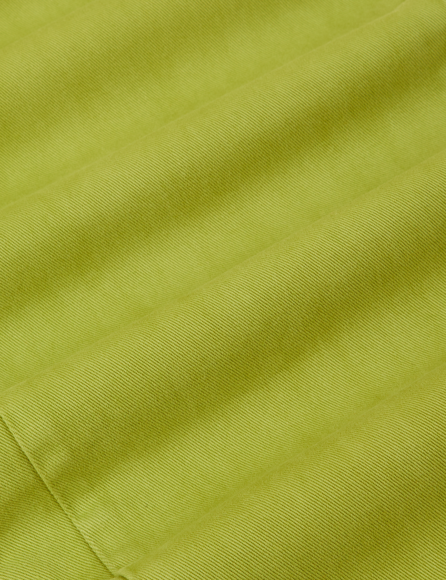 Work Pants in Gross Green fabric detail close up