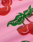 Cherry Paintstamped Work Pants in Bubblegum Pink close up of paintstamped red cherries with green stem