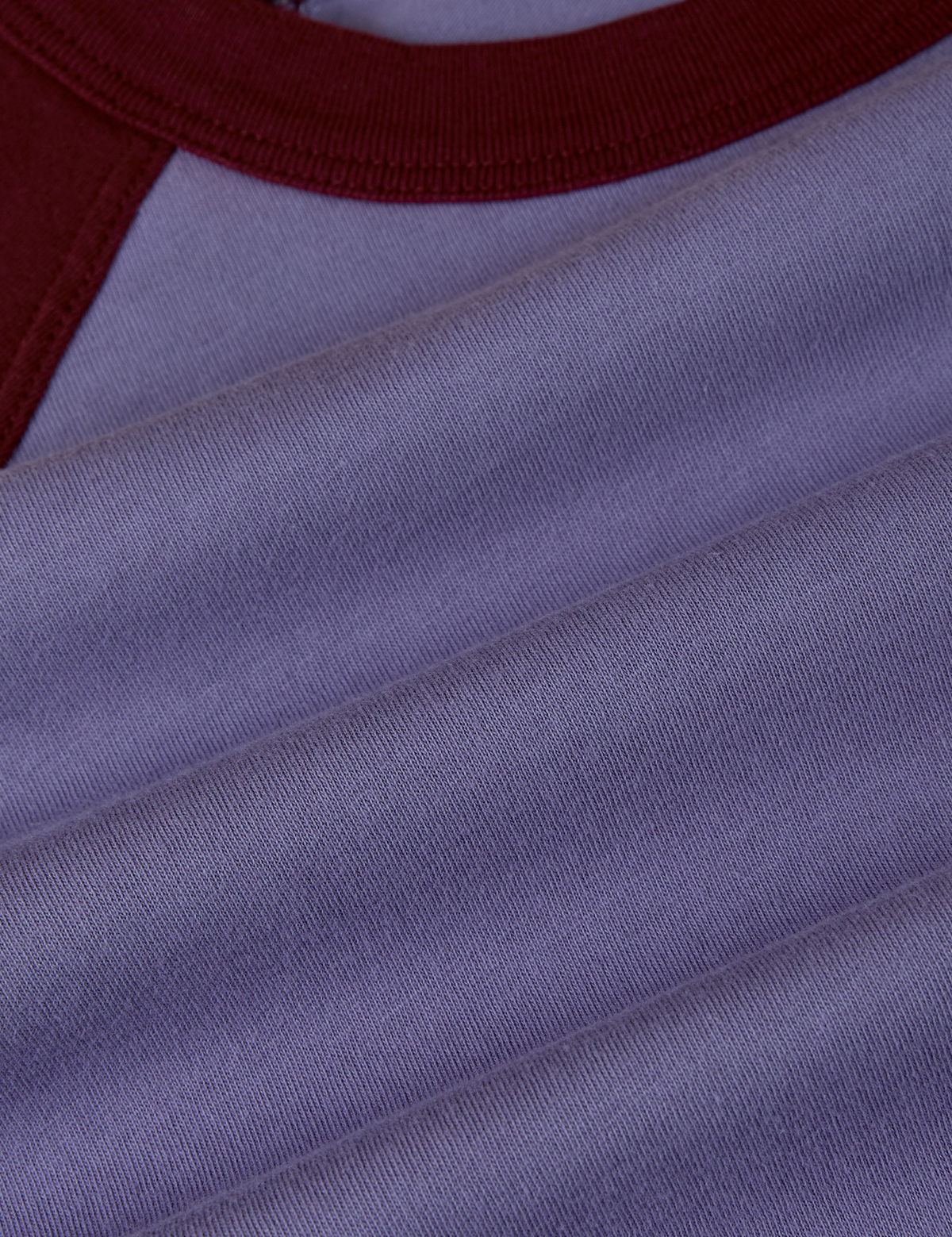 Fabric close up of the Faded Grape/Wine Colorblock Raglan Tee