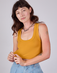 Alex is wearing Cropped Tank Top in Mustard Yellow