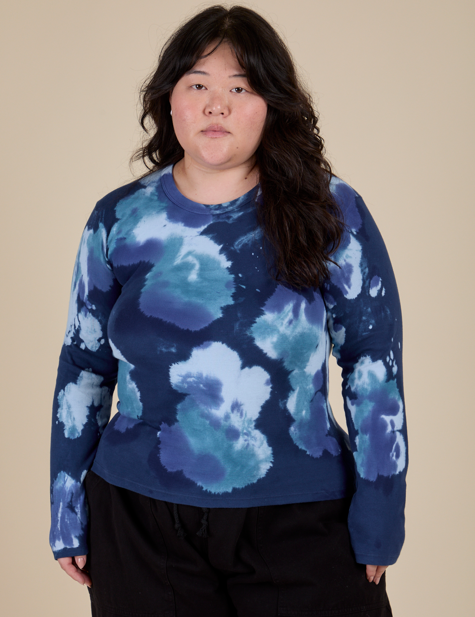 Ashley is 5’7” and wearing L Long Sleeve Baby Tee in Blue Magic Waters