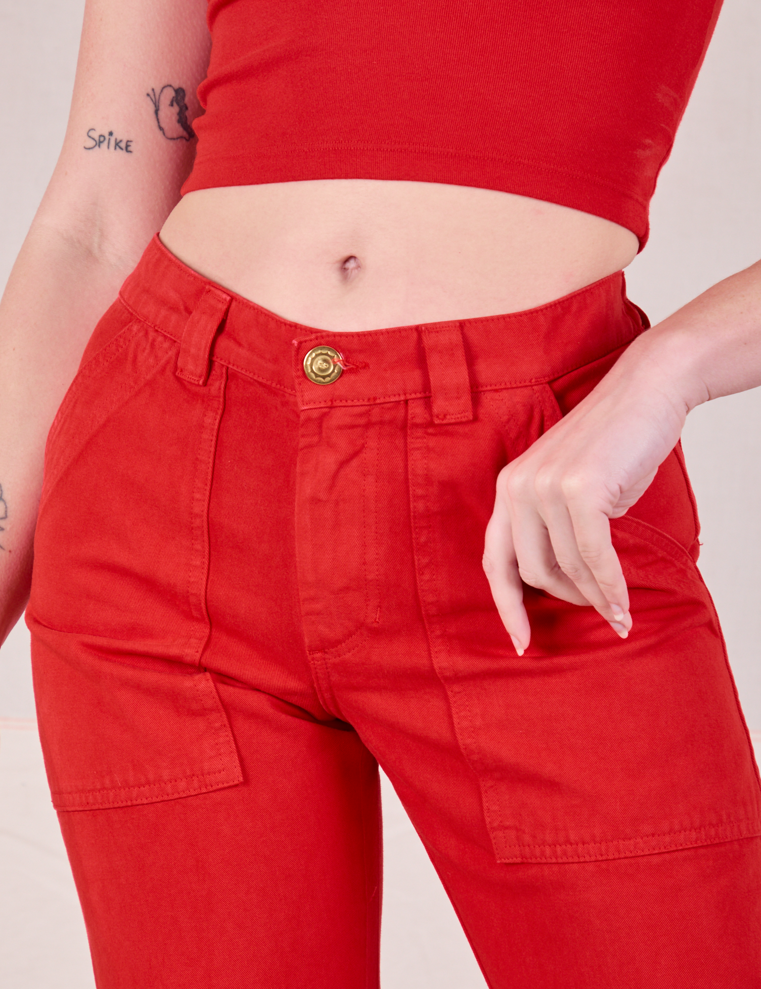 Mid-Rise Work Pants in Mustang Red close up on Alex