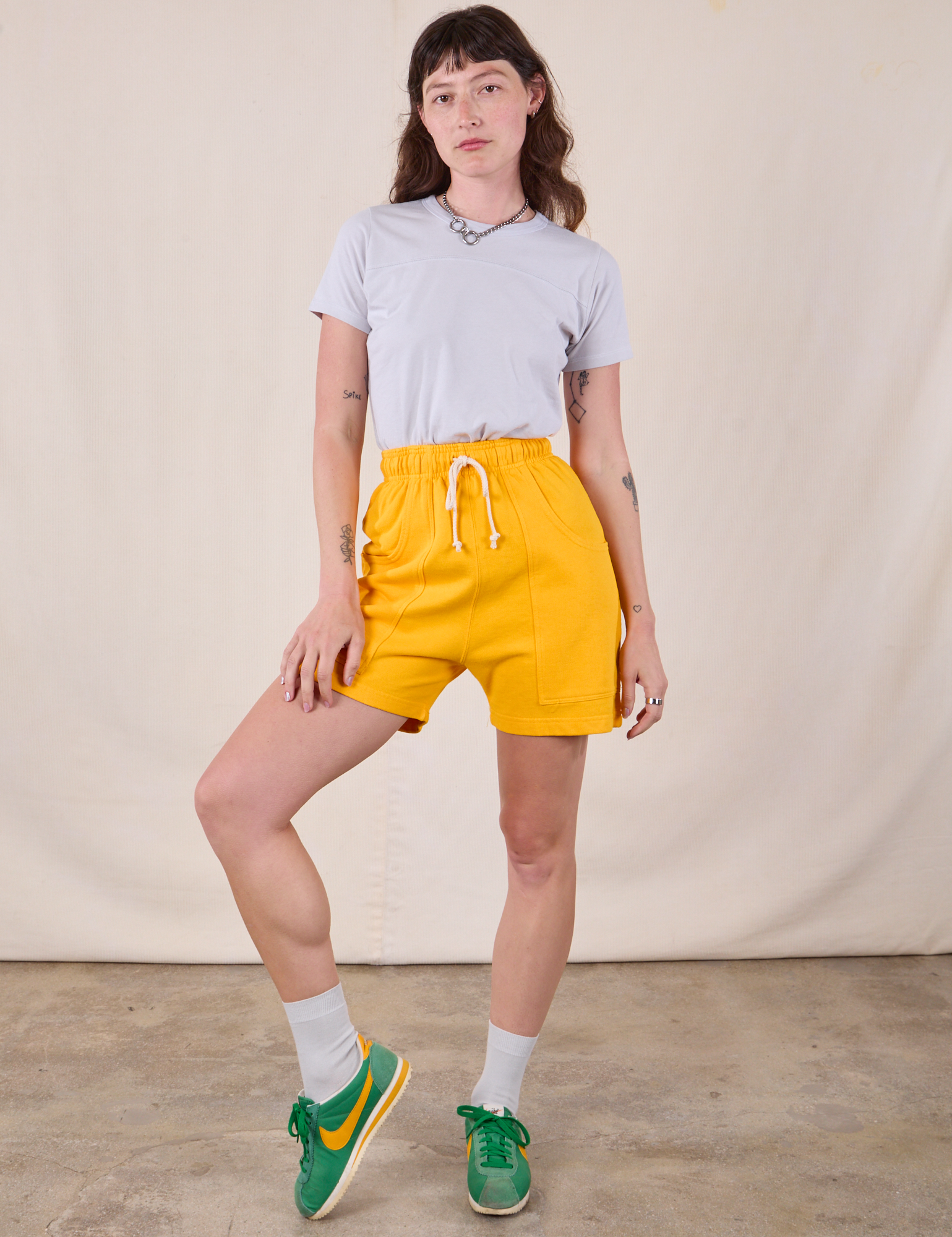 Sweat Shorts in Sunshine Yellow and stone white Jr. Varsity Tee on Alex