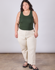 Ashley is wearing Tank Top in Swamp Green paired with vintage tee off-white petite Work Pants