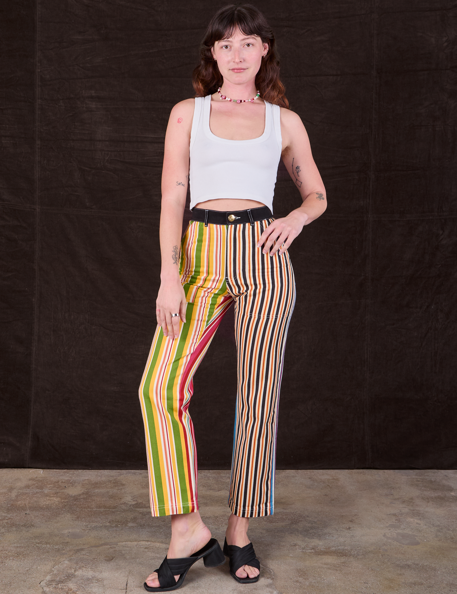 Alex is 5'8" and wearing XXS Mixed Stripe Work Pants paired with a Cropped Tank in vintage tee off-white