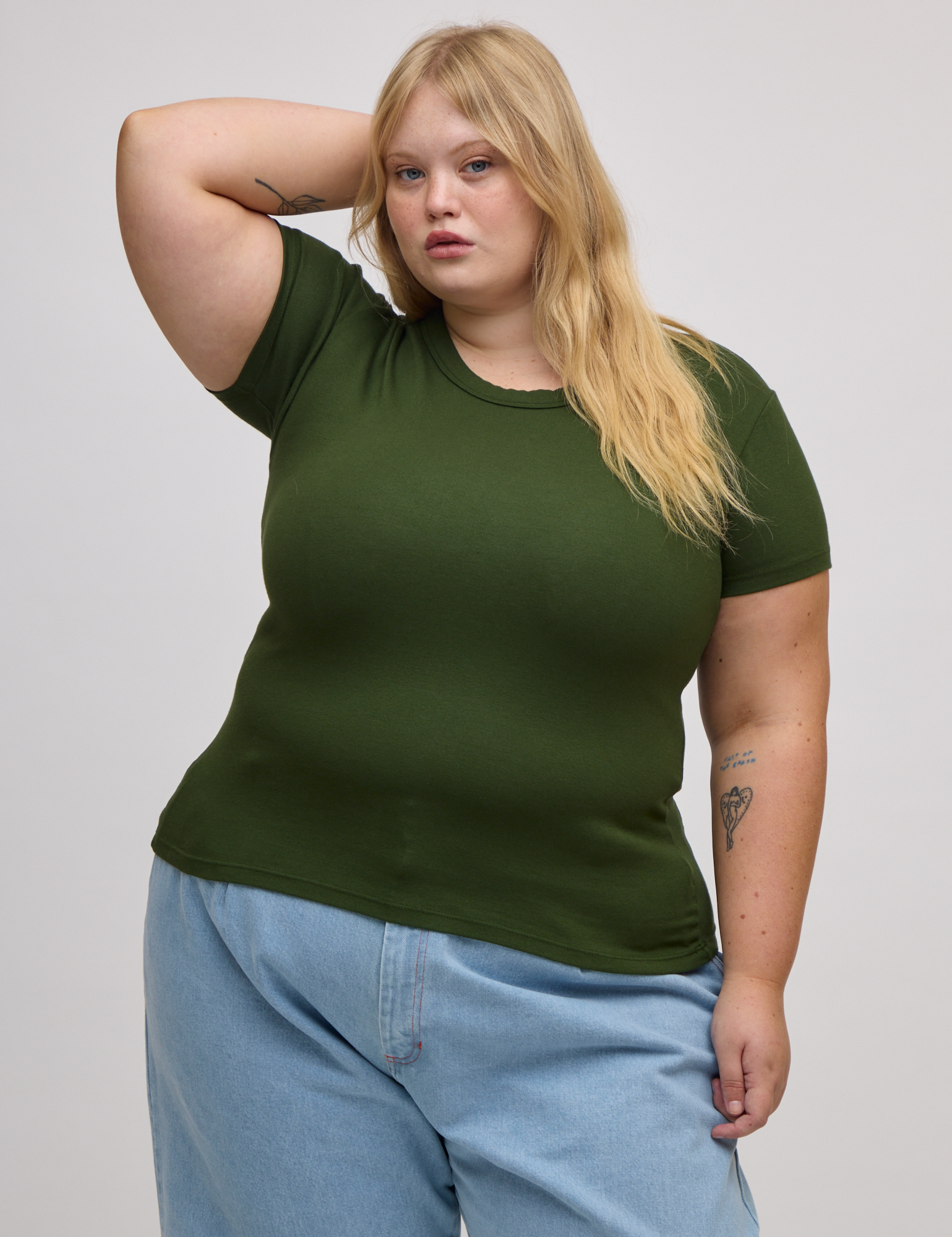 Juliet is wearing Baby Tee in Evergreen