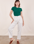 Alex is wearing Baby Tee in Hunter Green and vintage off-white Heavy Weight Trousers