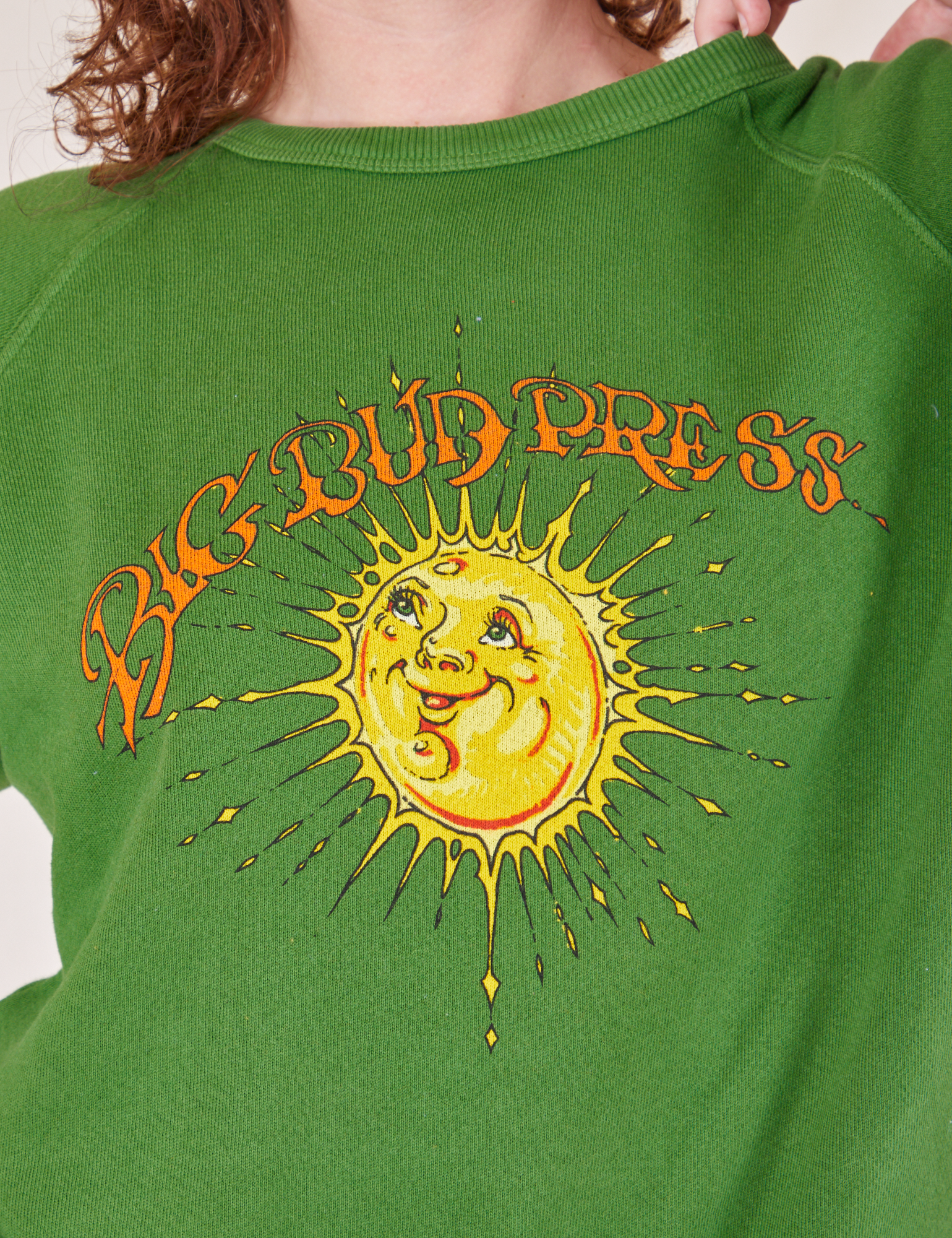 Bill Ogden&#39;s Sun Baby Crew in Lawn Green front close up on Alex