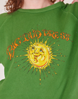 Bill Ogden's Sun Baby Crew in Lawn Green front close up on Alex