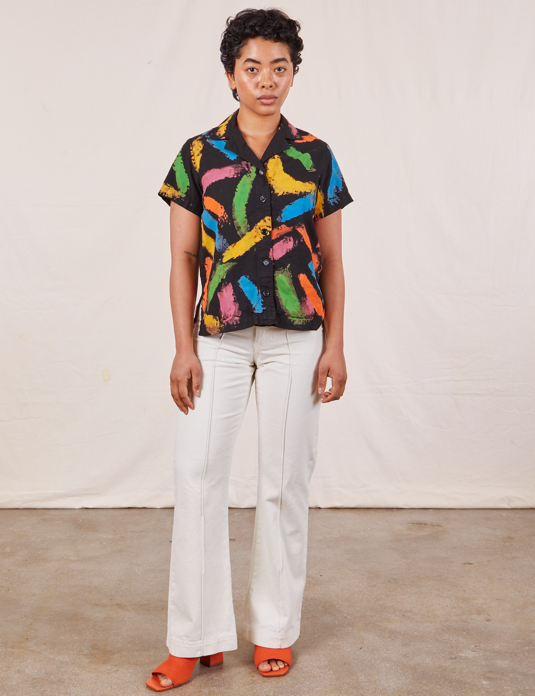 Mika is wearing Pantry Button Up in Paint Stroke and vintage off-white Western Pants