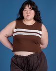 Ashley is wearing Painted Muscle Tee in Fudgesicle Brown