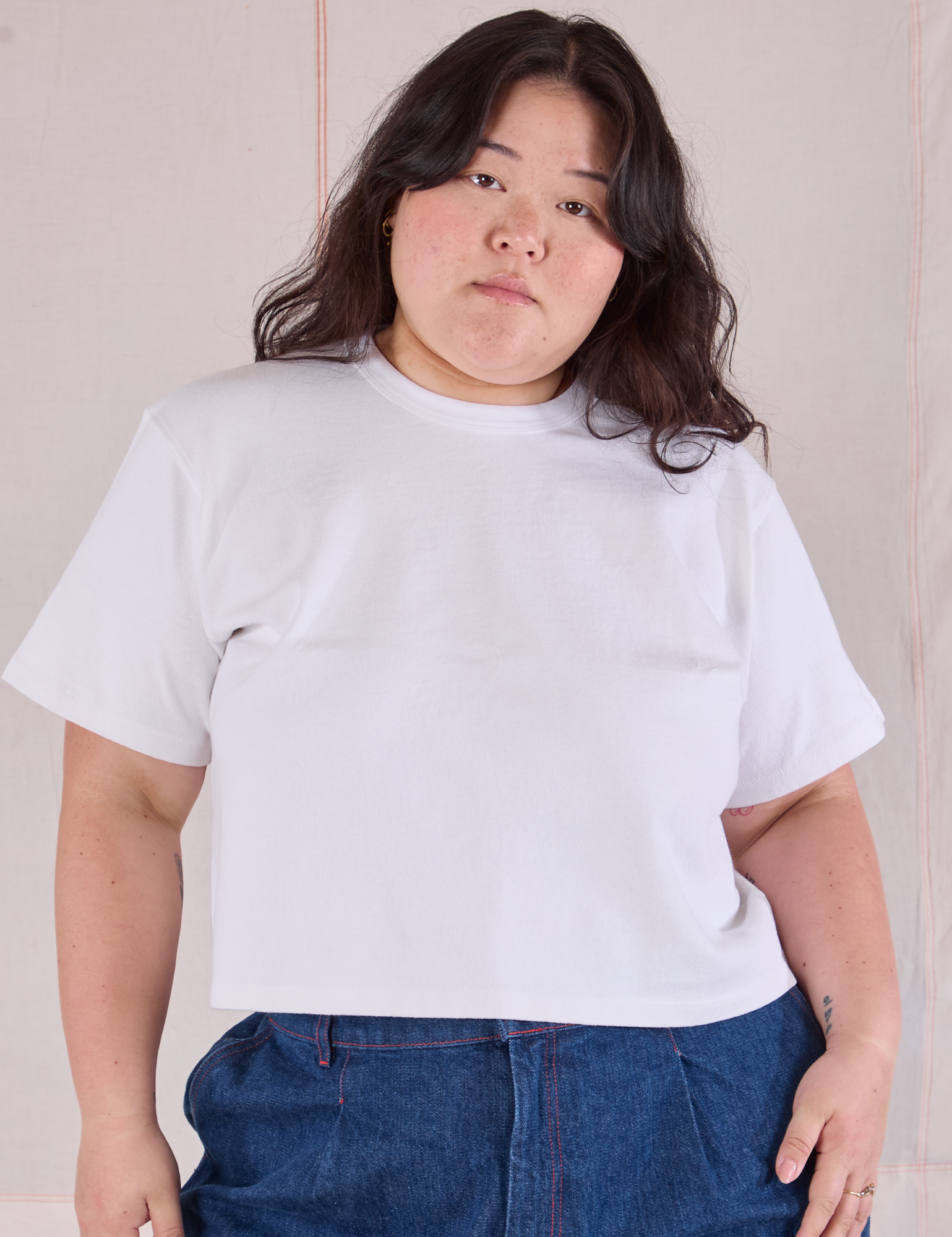 Ashley is wearing Cropped Burly Tee in Vintage Tee White
