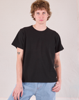 Quinn is 6'3" and wearing S Burly Tee in Basic Black