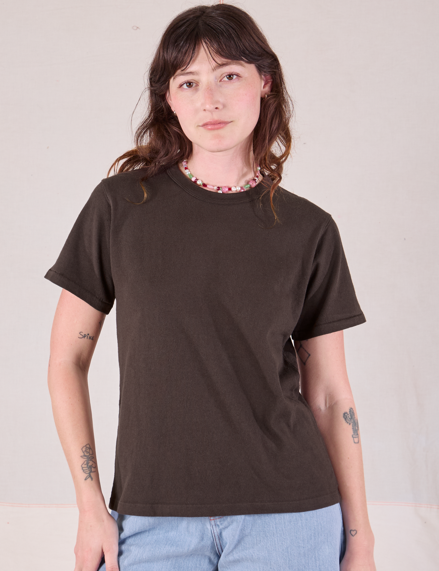 Alex is 5'8" and wearing P Burly Tee in Espresso Brown