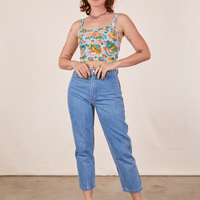 Alex is wearing Butterfly Bash Cami and light wash Frontier Jeans