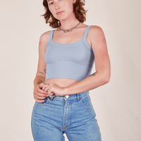 Alex is wearing Cropped Cami in Periwinkle and light wash Frontier Jeans